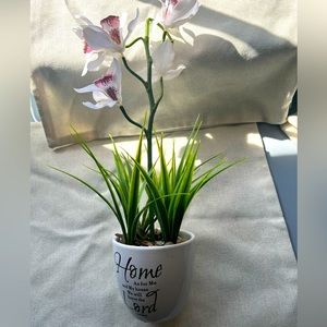 Fake flower plant with rocks as a base